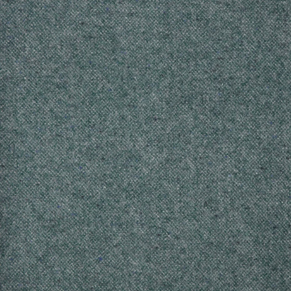 Muted petrol blue-green Donegal fabric with a fine, softly mottled woven texture