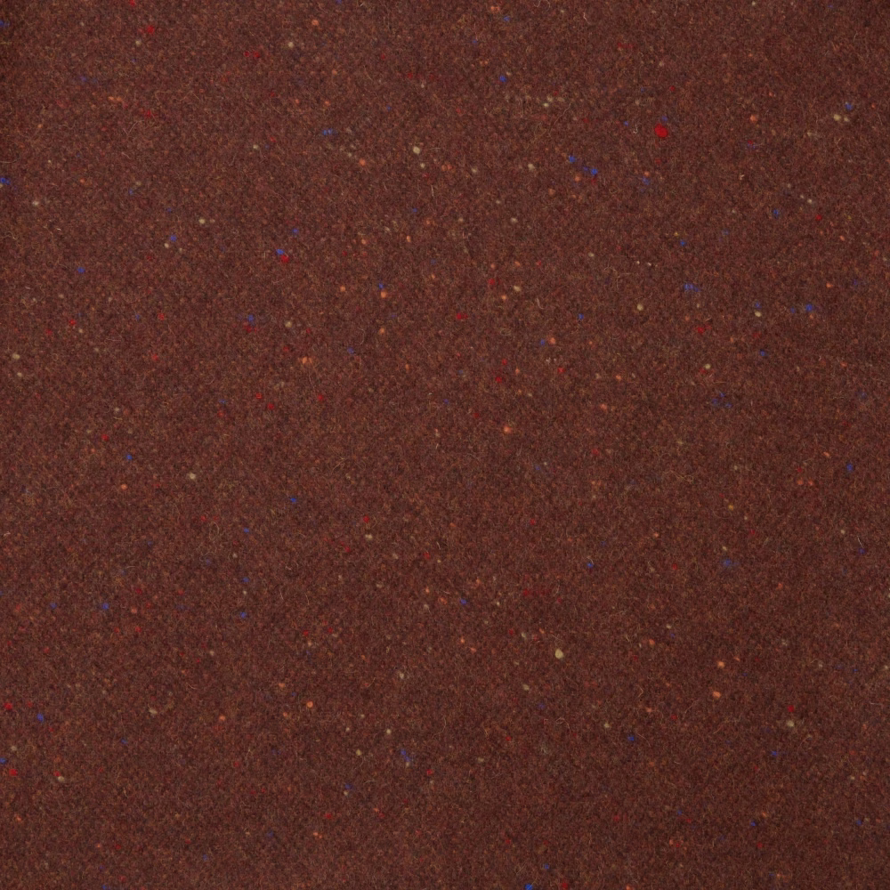 Deep pomegranate brown woven fabric with scattered red, blue and warm flecks