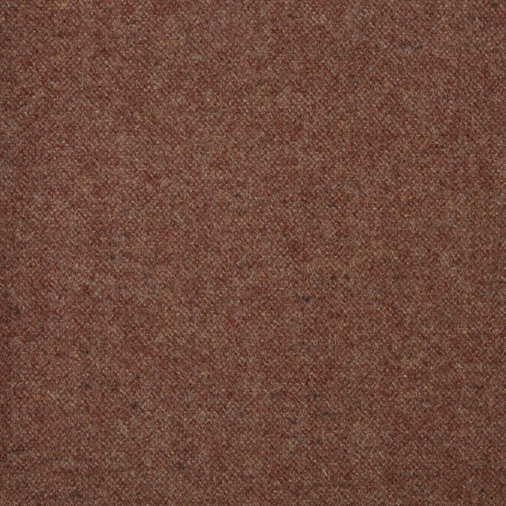 Close-up of muted russet-red fabric with a fine, softly mottled woven texture