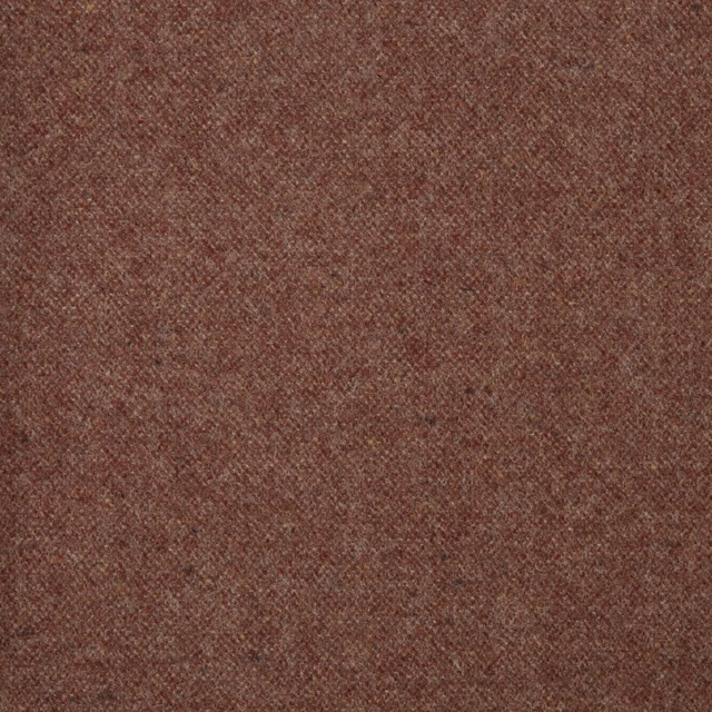 Close-up of muted russet-red fabric with a fine, softly mottled woven texture