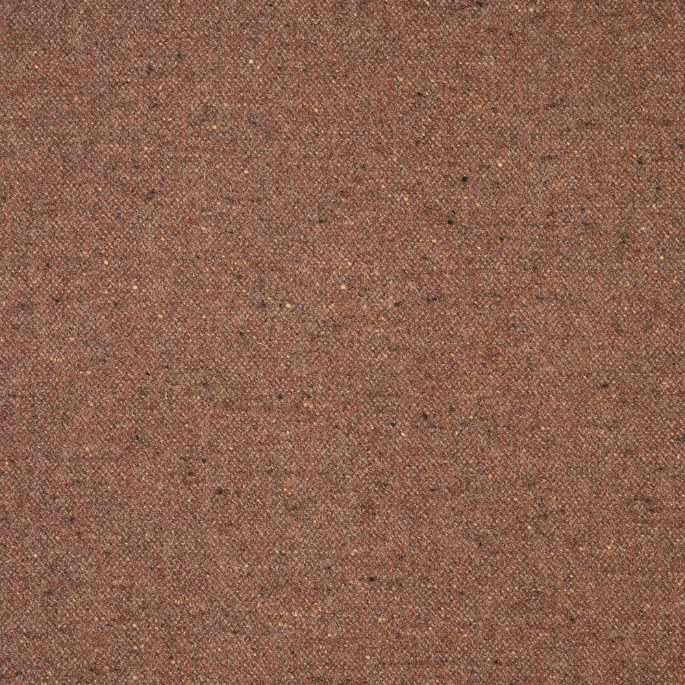 Close-up of muted terracotta-brown woven fabric with fine dark flecks