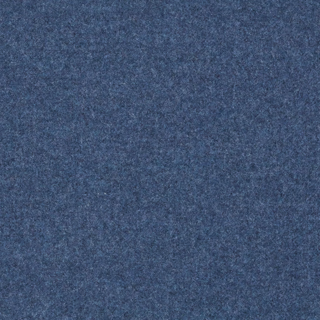 Close-up of dense mottled slate-blue fabric with a softly fuzzy textured surface