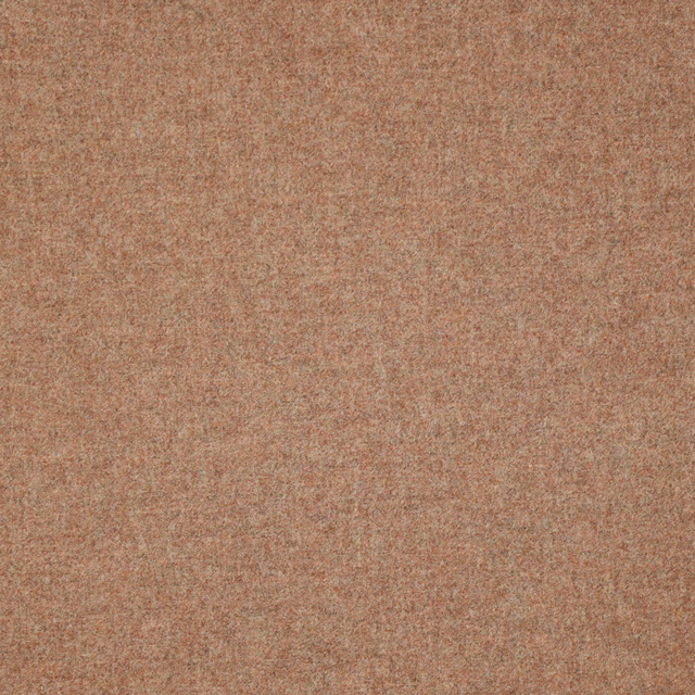 Close-up of finely mottled dusty salmon-pink woven fabric with warm earthy shading