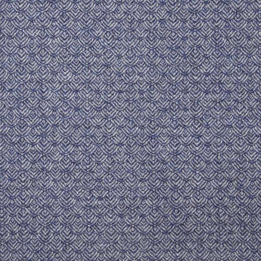 Muted denim-blue fabric with small repeating grey chevrons and a close textured weave