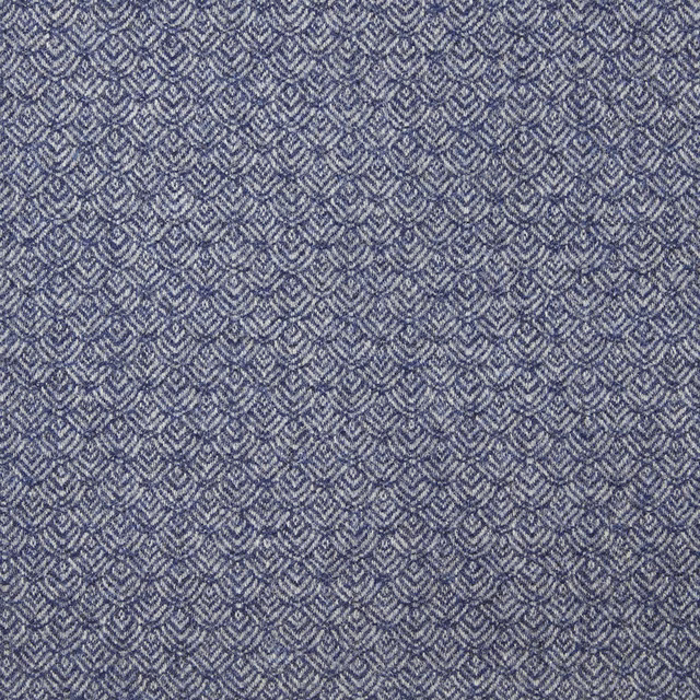 Muted denim-blue fabric with small repeating grey chevrons and a close textured weave