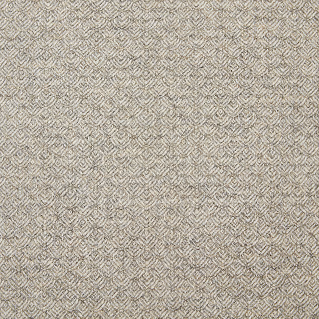 Warm natural greige fabric with a small repeating chevron weave and tactile surface