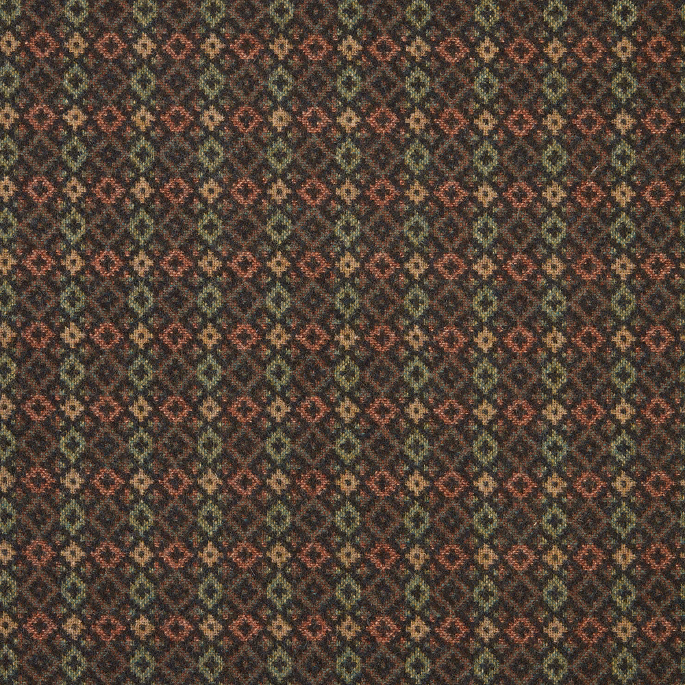 Dark evergreen woven textile with rust and tan diamond motifs