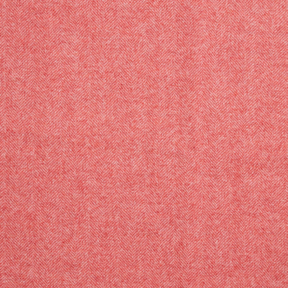Close-up of muted flamingo coral fabric with a fine woven herringbone texture