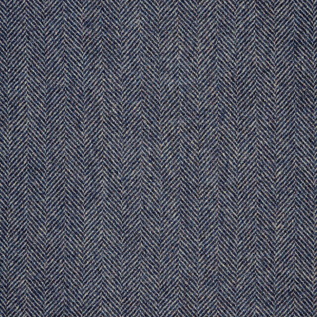 Muted denim-blue herringbone weave with fine chevrons and a softly textured surface