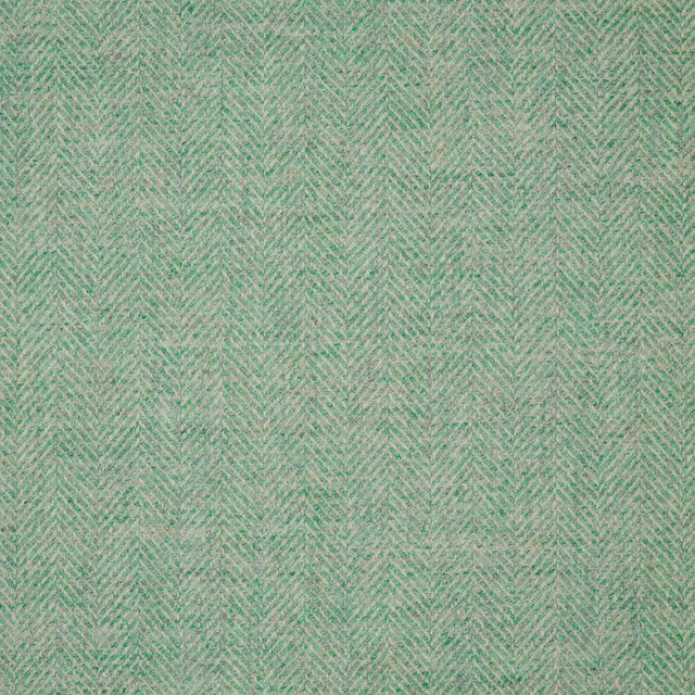 Soft mint-green herringbone weave with warm beige flecks and fine texture