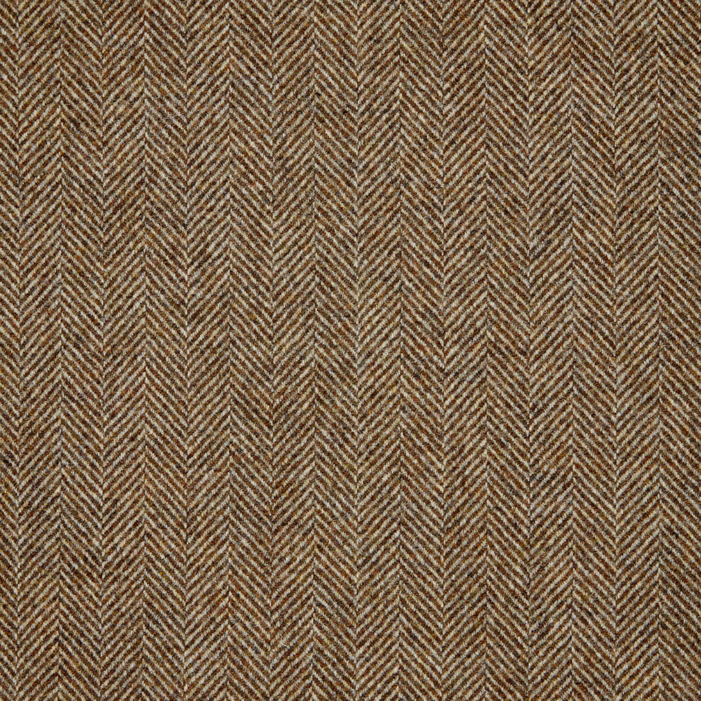 Close-up of warm ochre and brown woven fabric in a fine herringbone pattern