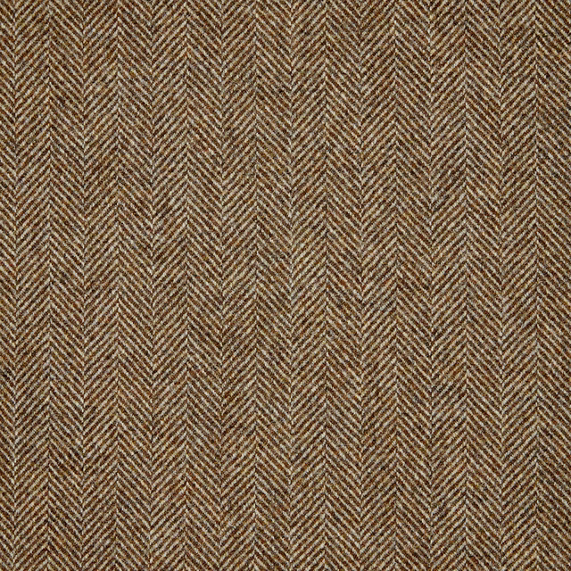 Close-up of warm ochre and brown woven fabric in a fine herringbone pattern