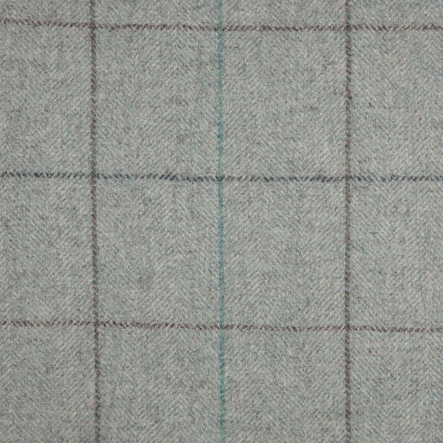 Cool slate blue-grey herringbone with charcoal pane lines and a muted teal accent