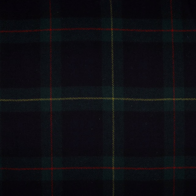 Near-black woven tartan with forest-green blocks and fine red and ochre lines