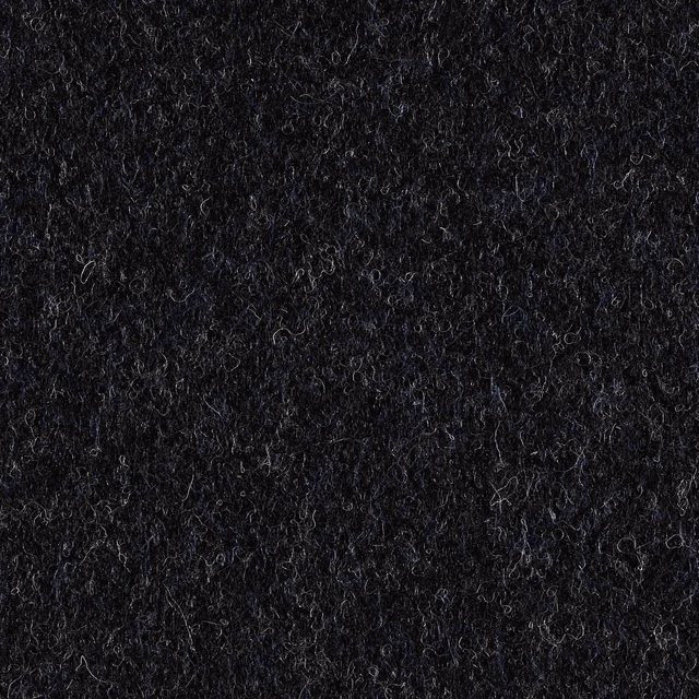 Deep indigo-black upholstery swatch showing dense curly fibres and subtle blue highlights