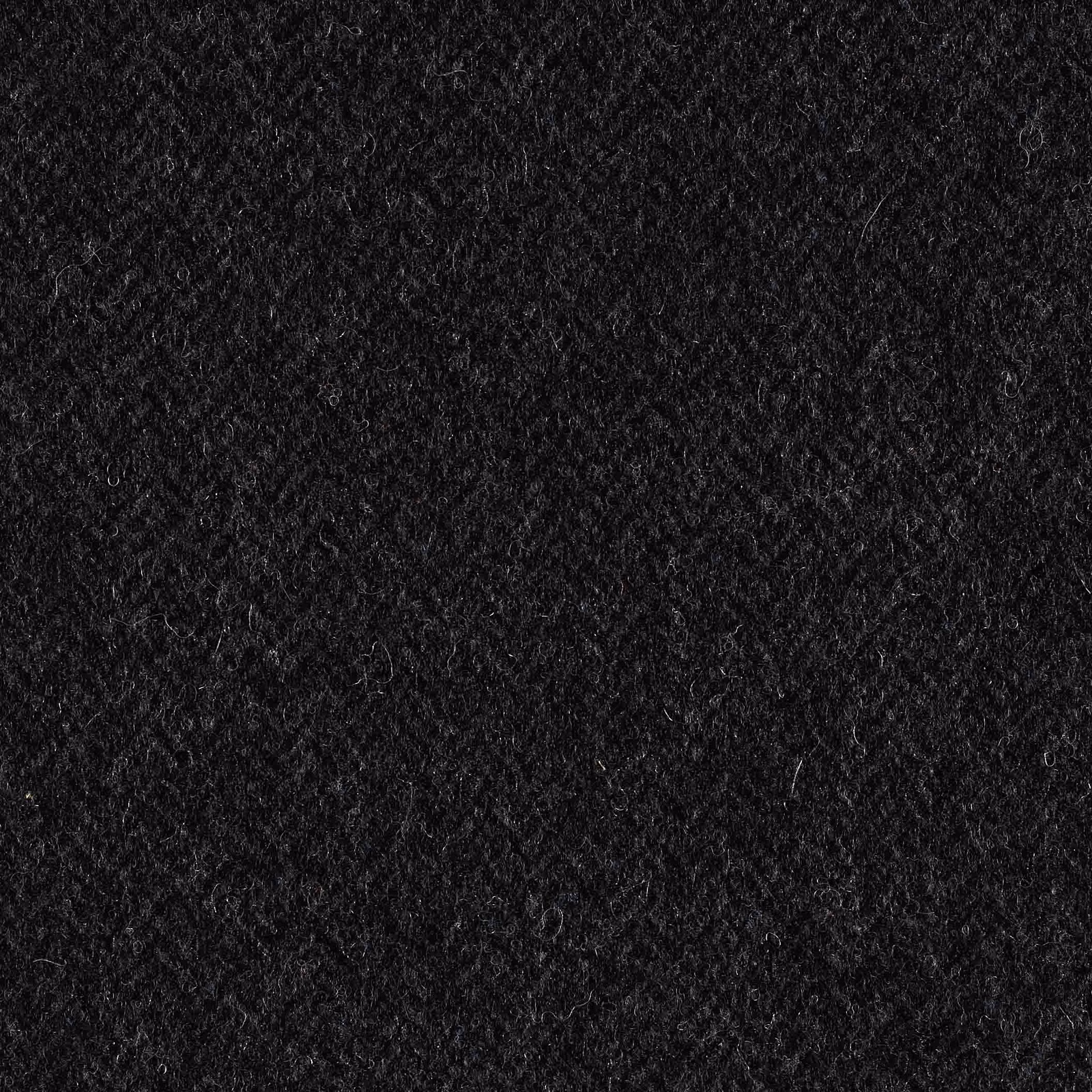 Near-black indigo upholstery fabric with dense, softly napped textured surface