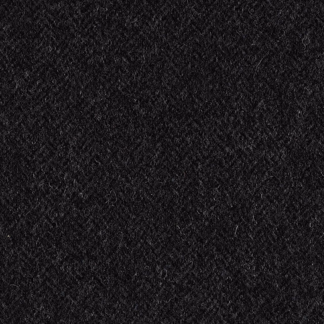 Near-black indigo upholstery fabric with dense, softly napped textured surface