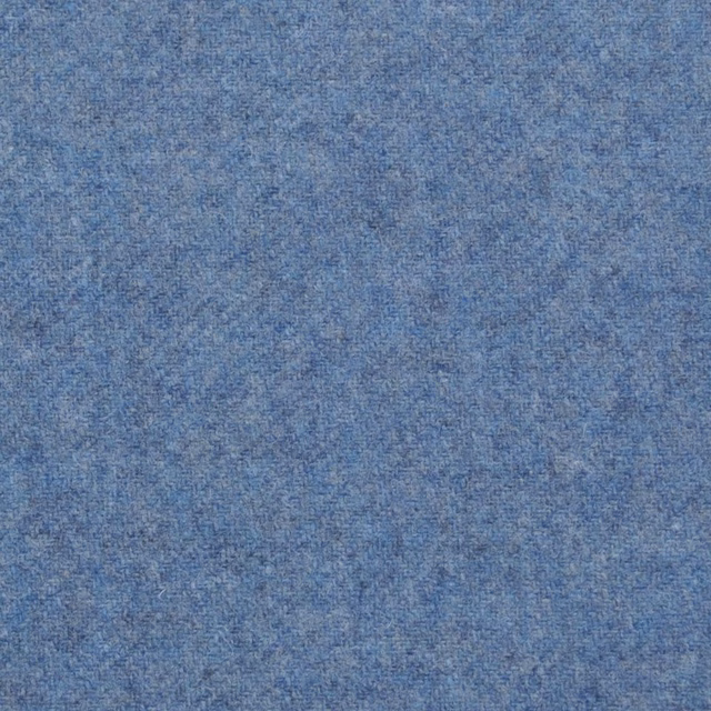 Muted denim-blue textile with softly mottled lighter and darker woven threads