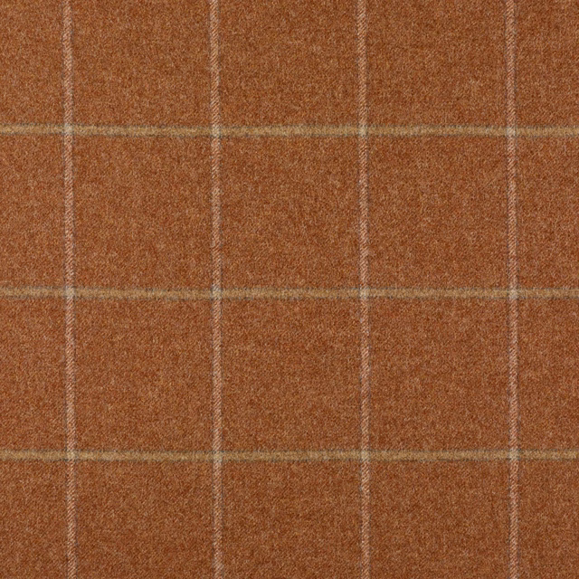 Warm red-earth checked textile with pale windowpane lines and nubby woven texture