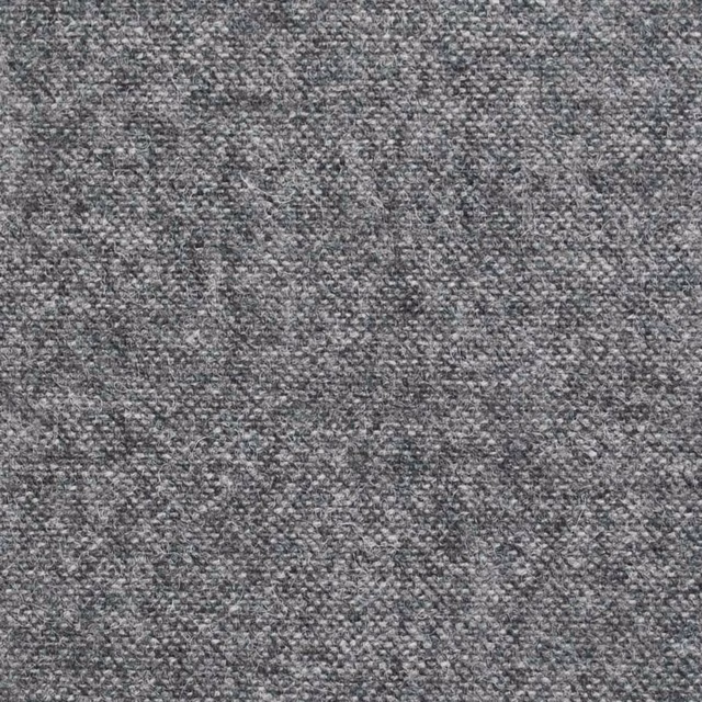Close-up of cool light grey fabric with dense charcoal-flecked nubby weave