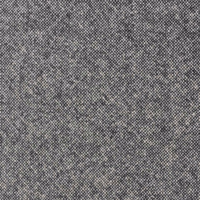 Light vintage grey textile with dense peppered weave and softly mottled tonal shading