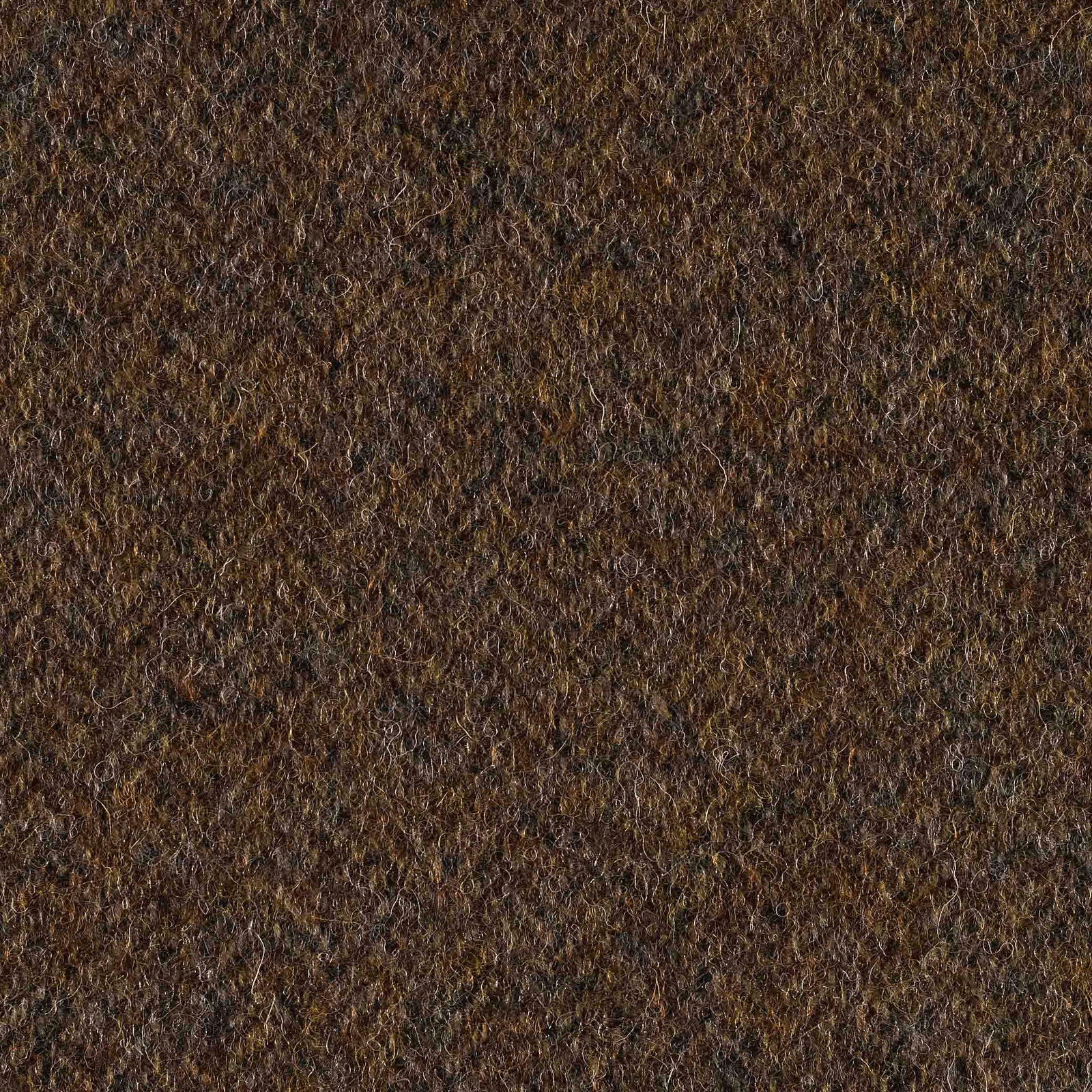Dark loden green shaggy weave with brown and charcoal flecks in close view
