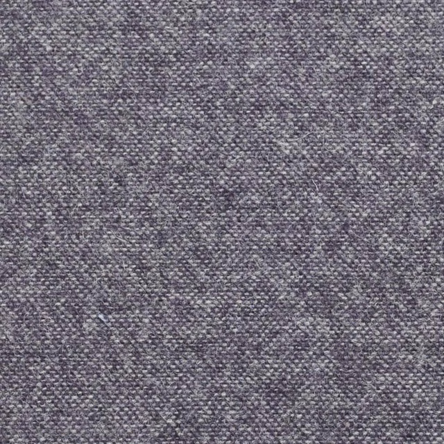 Close-up of charcoal grey-plum fabric with fine flecked woven texture