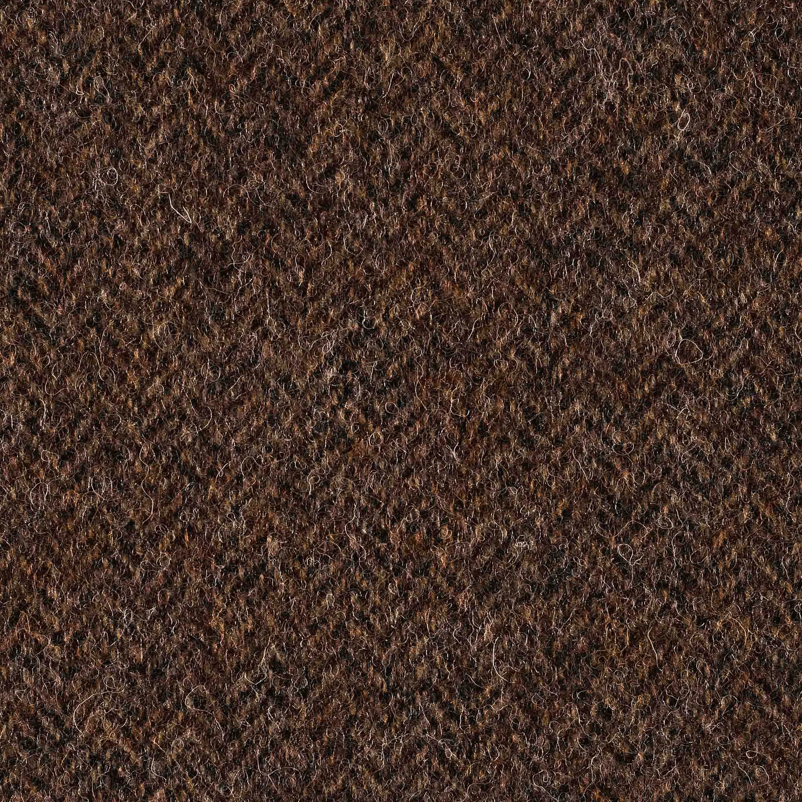 Deep brown fabric with dense irregular loops and warm coppery fibre highlights