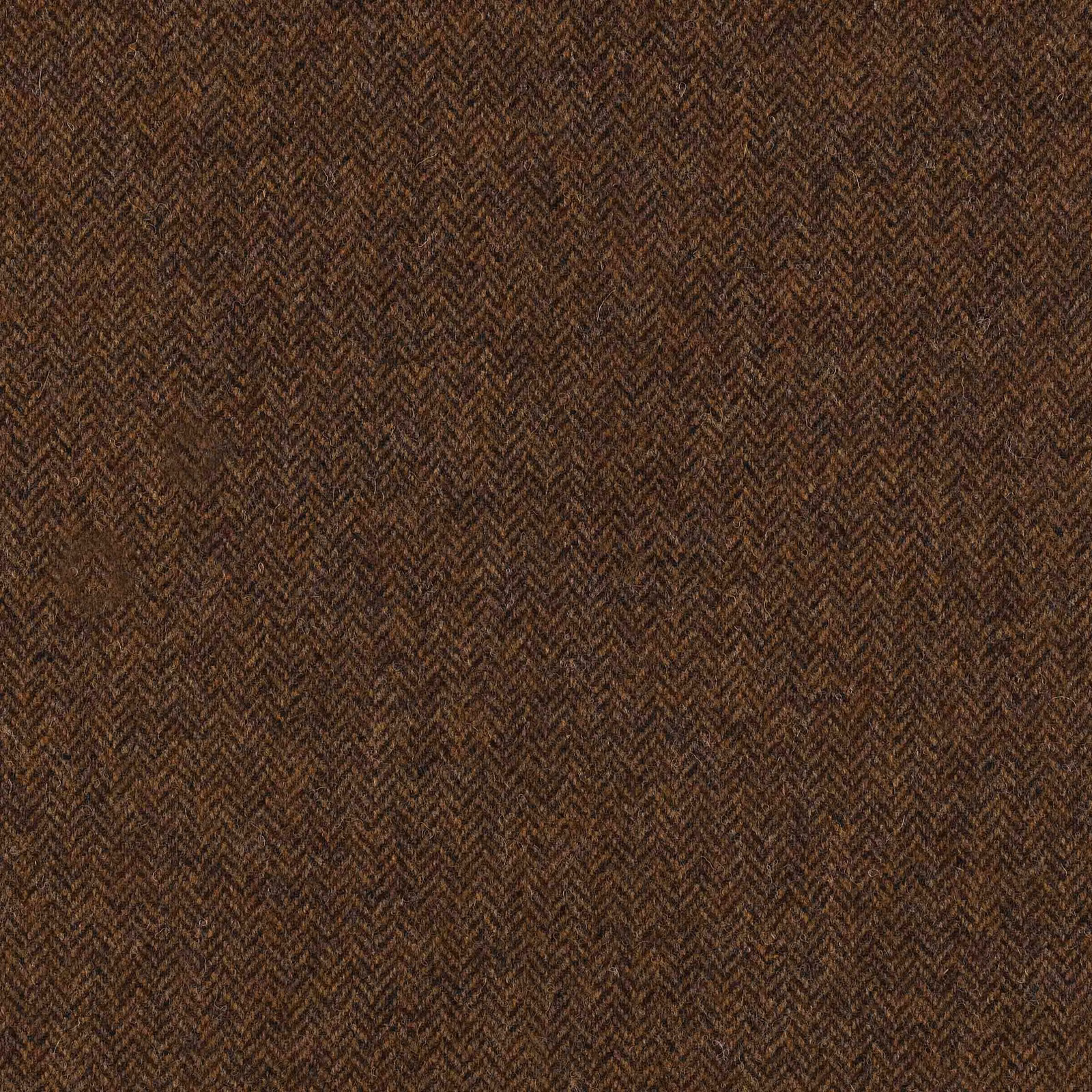 Close view of mid-brown woven herringbone with charcoal-brown flecks