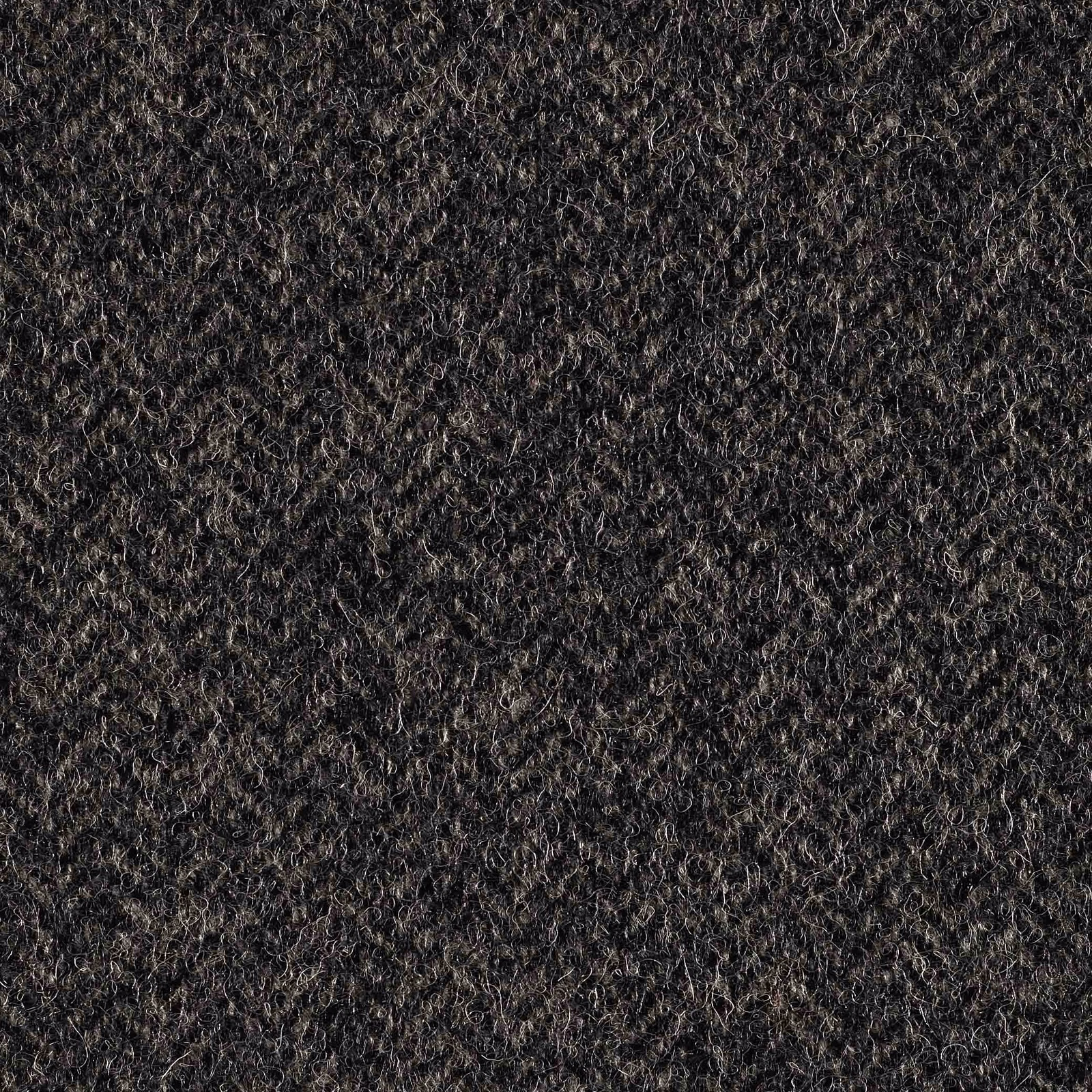 Charcoal mid-grey looped fabric with scattered pale fibres and dense tactile texture