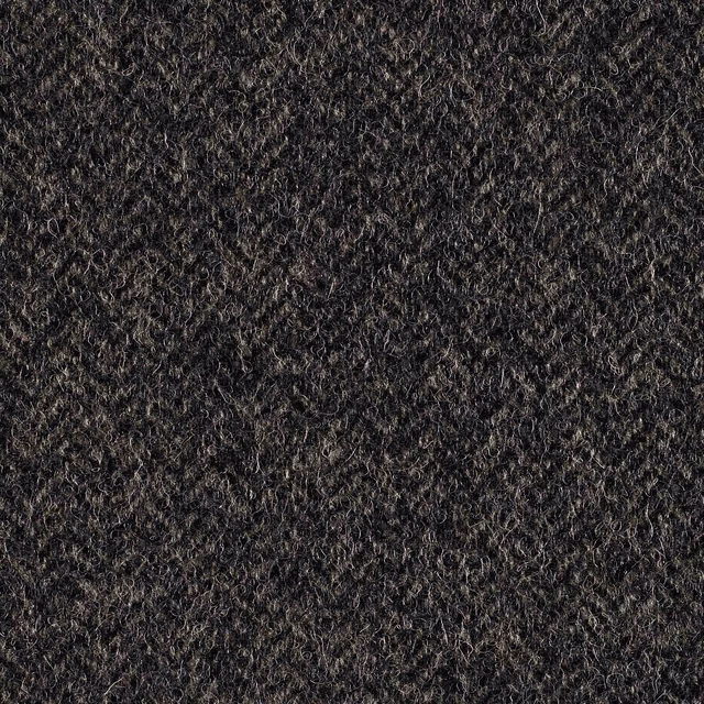 Charcoal mid-grey looped fabric with scattered pale fibres and dense tactile texture