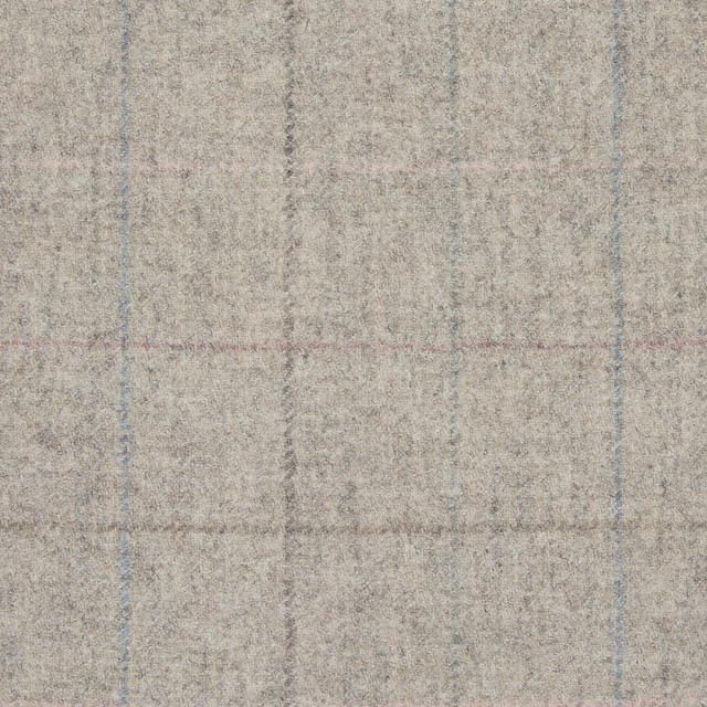 Close-up of softly textured sandstone beige plaid with faded blue-grey and blush lines