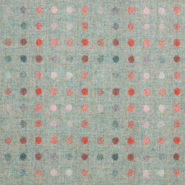 Textured aqua fabric with rows of small coral, pink, plum and grey spots
