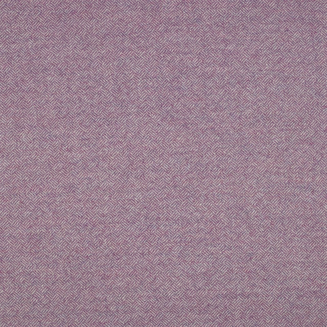 Close-up of dusty lilac woven fabric with a tiny mauve parquet chevron pattern