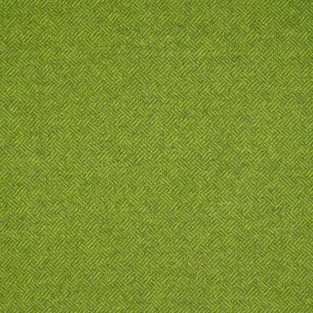 Close view of lime-green fabric with a tiny, textured parquet herringbone weave