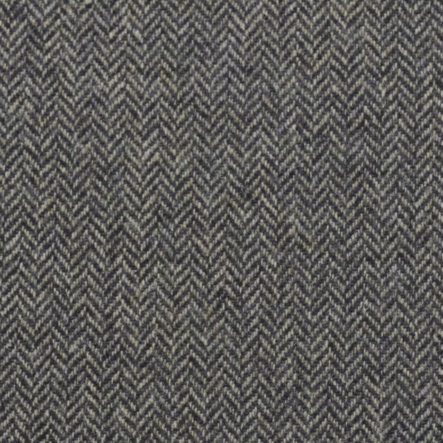 Cool pewter-grey fabric with a tightly repeated charcoal-and-silver herringbone weave