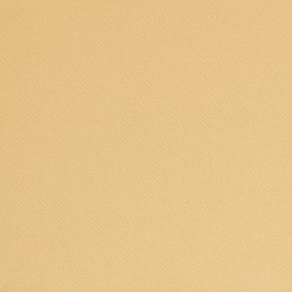 Close view of smooth warm corn-yellow satin with a subtle even sheen