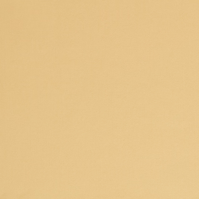 Close view of smooth warm corn-yellow satin with a subtle even sheen