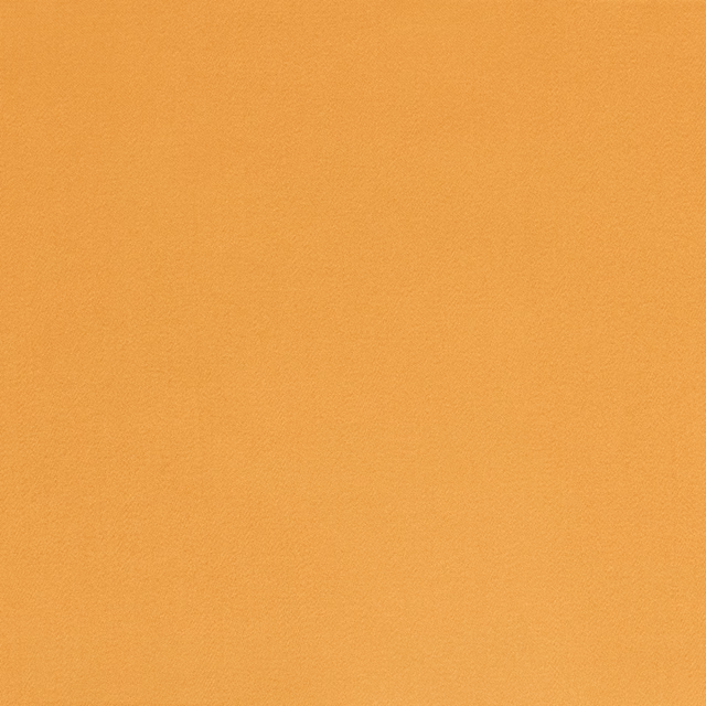 Close-up of plain ochre-gold satin with a fine texture and soft sheen
