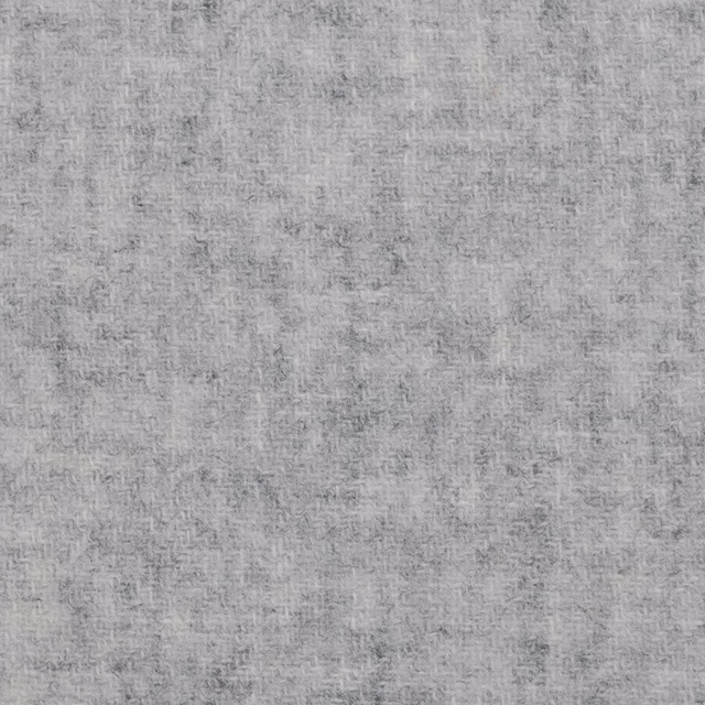 Pale silver grey fabric with fine charcoal flecks and softly mottled woven texture