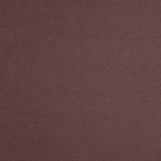 Close-up of muted aubergine fabric with a fine, softly mottled texture