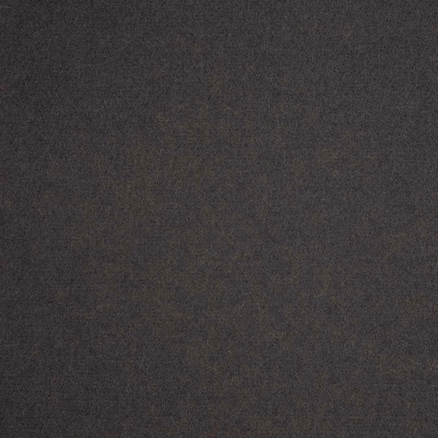 Close-up of deep charcoal-grey fabric with a fine, softly mottled woven texture