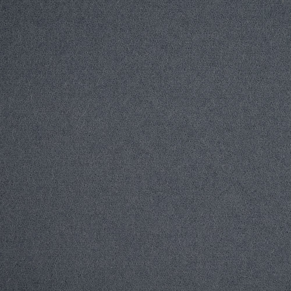 Close-up of charcoal denim-blue fabric with a fine, softly mottled texture