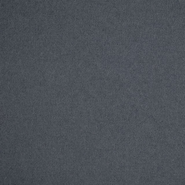 Close-up of charcoal denim-blue fabric with a fine, softly mottled texture