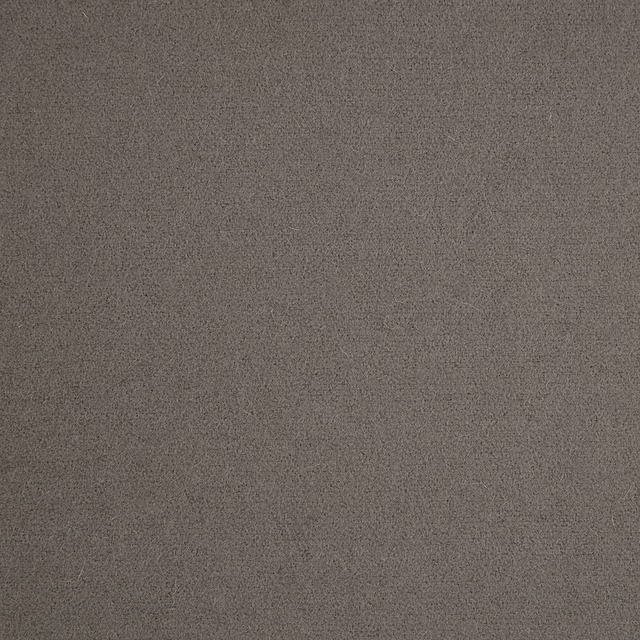 Close-up of softly mottled warm grey textile with a fine-grained surface