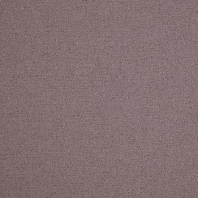 Close-up of finely textured plain fabric in muted dusty lilac mauve