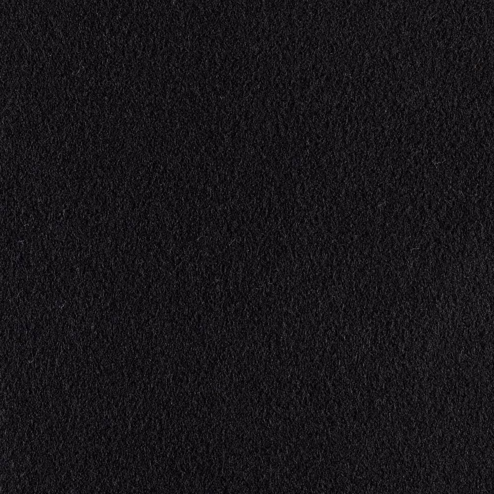 Close-up of deep black fabric with a dense, softly raised textured surface