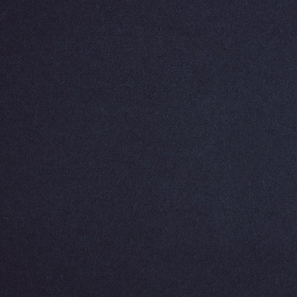 Close-up of dark royal-blue fabric with a softly mottled, low-sheen texture