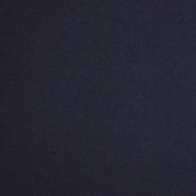 Close-up of dark royal-blue fabric with a softly mottled, low-sheen texture