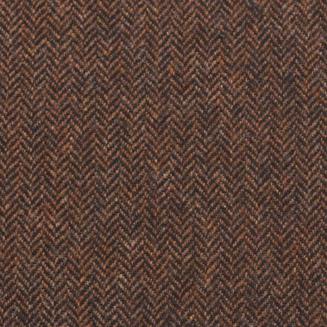 Dark tobacco and black woven herringbone with a compact, tactile surface